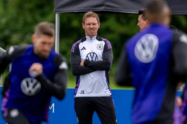 National football team, training on 11 06 2024 in Herzogenaurach National coach Julian Nagelsmann ponders Important note According to FIFA or UEFA regulations, it is prohibited to use or have used photographs taken in the stadium and or of the match in the form of sequential images and or video-like photo series Foto Kirchner Media DI Copyright: xKirchner-Media DIx