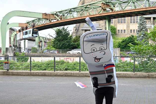 GER, UEFA European Championship 2024, Slovenian Base Camp Wuppertal 12 06 2023,Wuppertal ,Stadion am Zoo, GER, UEFA European Championship 2024, Slovenian Base Camp Wuppertal in the picture the Wuppertal mascot Schwuppi in front of the suspension railroad NordphotoxGmbHx xFreund nph00018