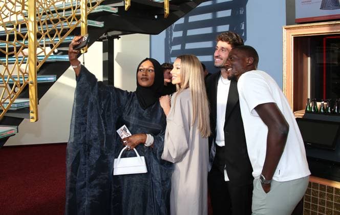 12 06 2024, Germany, Leonberg, Football Bundesliga, VfB in Team, Film premiere Traumpalast Leonberg, 6 pm red carpet, 7 30 talk, then film, Atakan Karazor and Serhou Guirassy take selfies with their companions