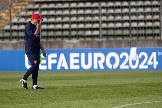 Dragan Stojkovic coach Serbia , pensive, in the background the logo of the EURO 2024 European Championship 2024 national team Serbia, public training, Rosenau Stadium Augsburg