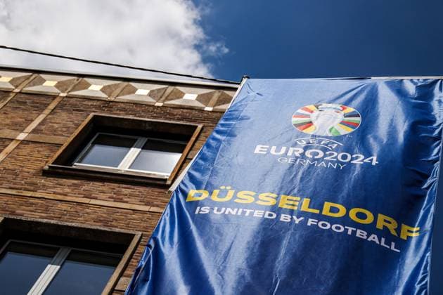 Sport, Football, UEFA EURO 2024 Host City Düsseldorf before the start of the European Championship 2024 12 06 2024, Düsseldorf flag with the UEFA EURO 2024 logo and the lettering Düsseldorf is United By Football in the old town of Düsseldorf North Rhine-Westphalia Germany