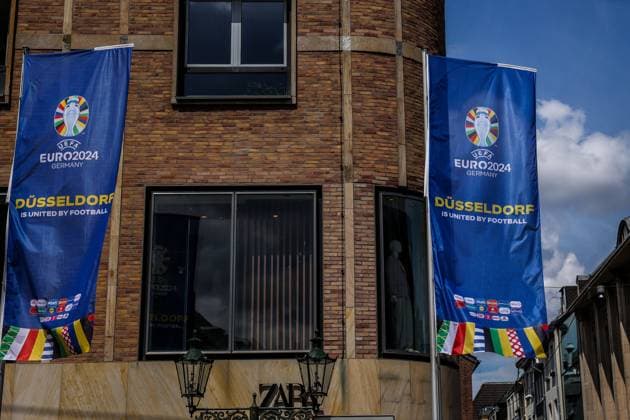 Sport, Football, UEFA EURO 2024 Host City Düsseldorf before the start of the European Championship 2024 12 06 2024, Düsseldorf flag with the UEFA EURO 2024 logo and the lettering Düsseldorf is United By Football in the old town of Düsseldorf North Rhine-Westphalia Germany