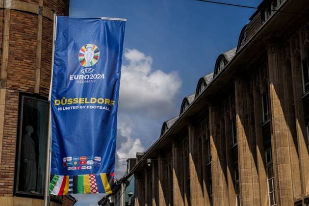 Sport, Football, UEFA EURO 2024 Host City Düsseldorf before the start of the European Championship 2024 12 06 2024, Düsseldorf flag with the UEFA EURO 2024 logo and the lettering Düsseldorf is United By Football in the old town of Düsseldorf North Rhine-Westphalia Germany