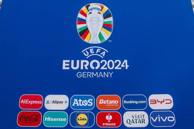 Sport, Football, UEFA EURO 2024 Host City Düsseldorf before the start of the European Championship 2024 12 06 2024, Düsseldorf Logo of UEFA EURO 2024 on a banner with the sponsors of the European Championship AliExpress, Alipay, Atos, Betano, Booking, BYD, Coca Cola, Hisense, Lidl, Engelbert Strauss, Visit Qatar and Vivo Düsseldorf North Rhine-Westphalia Germany