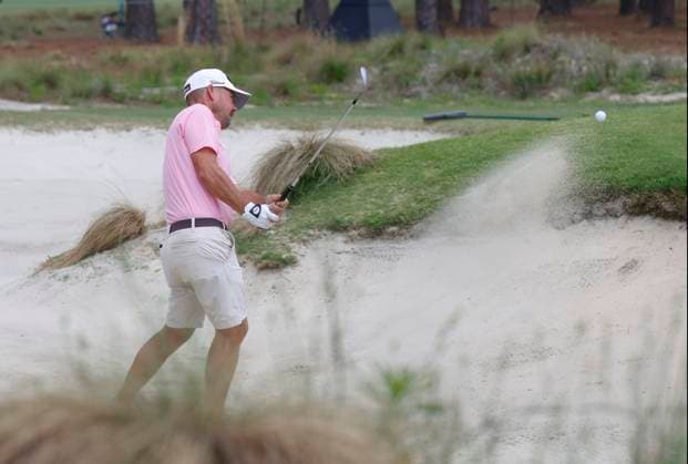Brian Harman chips out of a sand trap during a practice round at the 124th U.S. Open golf championship at Pinehurst Resort & Country Club in Pinehurst, N.C. on Wednesday, June 12, 2024.  NCP20240612121 JOHNxANGELILLO