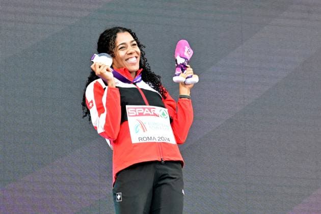 12th June 2024; Olympic Stadium, Rome, Italy; 2024 European Athletic Championships, Day 6; Mujinga KAMBUNDJI (SUI) celebrates with gold medal after winning the 200m Womens final  ActionPlus1265376120240612 AllShotLive