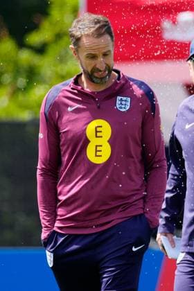 England manager Gareth Southgate gets caught in the sprinklers England Training Session and press conference, PK, Pressekonferenz UEFA European Championship, EM, Europameisterschaft 2024, Group C, Football, Spa & Golf Resort Weimarer Land, Blankenhain, Germany, 13 Jun 2024 EDITORIAL USE ONLY No use with unauthorised audio, video, data, fixture lists, club league logos or live services. Online in-match use limited to 120 images, no video emulation. No use in betting, games or single club league player publications. Copyright: xDavexShopland Shutterstockx 14523765c