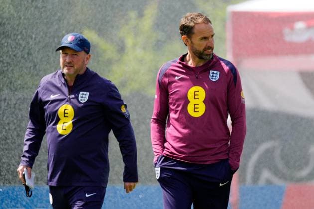England manager Gareth Southgate, England assistant Steve Holland get caught in the sprinklers England Training Session and press conference, PK, Pressekonferenz UEFA European Championship, EM, Europameisterschaft 2024, Group C, Football, Spa & Golf Resort Weimarer Land, Blankenhain, Germany, 13 Jun 2024 EDITORIAL USE ONLY No use with unauthorised audio, video, data, fixture lists, club league logos or live services. Online in-match use limited to 120 images, no video emulation. No use in betting, games or single club league player publications. Copyright: xDavexShopland Shutterstockx 14523765f