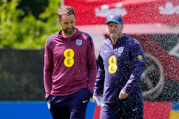 England manager Gareth Southgate, England assistant Steve Holland get caught in the sprinklers England Training Session and press conference, PK, Pressekonferenz UEFA European Championship, EM, Europameisterschaft 2024, Group C, Football, Spa & Golf Resort Weimarer Land, Blankenhain, Germany, 13 Jun 2024 EDITORIAL USE ONLY No use with unauthorised audio, video, data, fixture lists, club league logos or live services. Online in-match use limited to 120 images, no video emulation. No use in betting, games or single club league player publications. Copyright: xDavexShopland Shutterstockx 14523765e