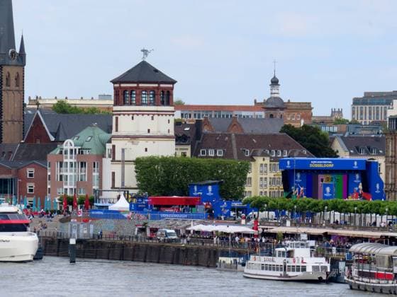 View of the fan mile with the Block Buster Terminal of the fan mile for the European Championship 2024 Duesseldorf Altstadt Schlossturm Big screen Fan Mile Public Viewing