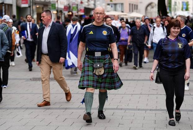 Scottish First Minister Swinney proposes public holiday for first World Cup match since 1998, archive pictures