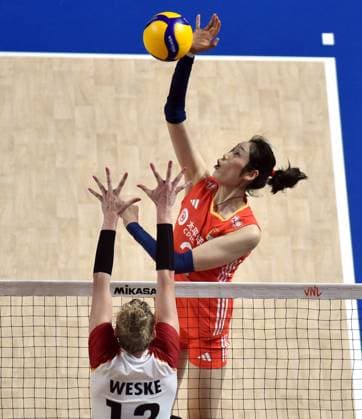 (240614) -- HONG KONG, June 14, 2024 -- Zhu Ting (top) of China spikes the ball during the preliminary match between China and Germany at the Women s Volleyball Nations League 2024 Hong Kong in Hong Kong, south China, June 14, 2024. ) (SP)CHINA-HONG KONG-VOLLEYBALL-WOMEN S NATIONS LEAGUE 2024-CHINA VS GERMANY (CN) LoxPingxFai 