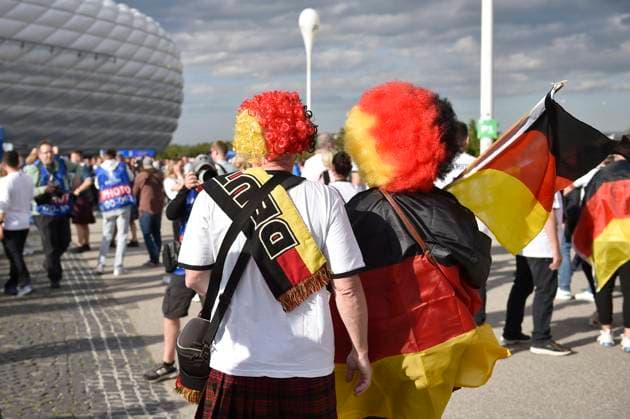 Fans,football fans with Germany flags,flags black red gold on the way to the stadium group stage group A Germany GER Scotland SCO on 14 06 2024 Football Arena Munich, Football UEFA EURO 2024 GERMANY from 14 06 2024 14 07 2024