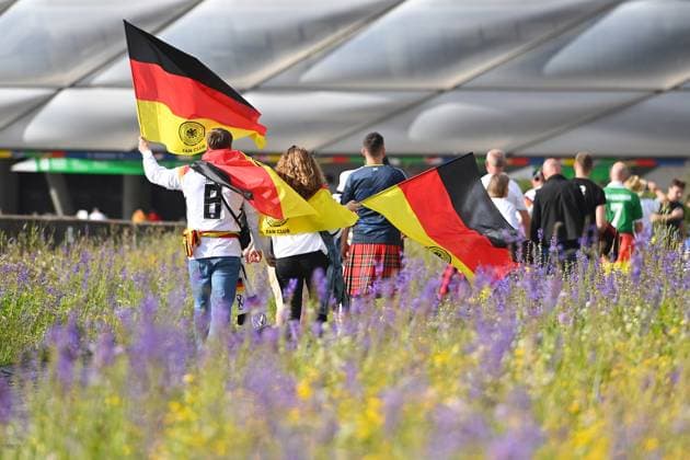 Fans,football fans with Germany flags,flags black red gold on the way to the stadium group stage group A Germany GER Scotland SCO on 14 06 2024 Football Arena Munich, Football UEFA EURO 2024 GERMANY from 14 06 2024 14 07 2024