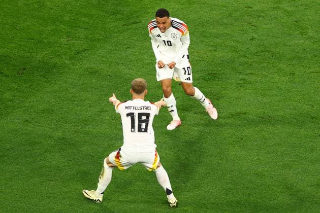 Jamal Musiala of Germany celebrates scoring the goal for their side with their teammates to make it 2-0 Germany v Scotland, UEFA European Championship, EM, Europameisterschaft 2024, Group A, Football, Munich Football Arena, Munich, Germany, 14 Jun 2024 EDITORIAL USE ONLY No use with unauthorised audio, video, data, fixture lists, club league logos or live services. Online in-match use limited to 120 images, no video emulation. No use in betting, games or single club league player publications. Copyright: xKieranxMcManus Shutterstockx 14523770bc