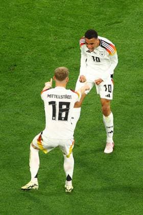 Jamal Musiala of Germany celebrates scoring the goal for their side with their teammates to make it 2-0 Germany v Scotland, UEFA European Championship, EM, Europameisterschaft 2024, Group A, Football, Munich Football Arena, Munich, Germany, 14 Jun 2024 EDITORIAL USE ONLY No use with unauthorised audio, video, data, fixture lists, club league logos or live services. Online in-match use limited to 120 images, no video emulation. No use in betting, games or single club league player publications. Copyright: xKieranxMcManus Shutterstockx 14523770be