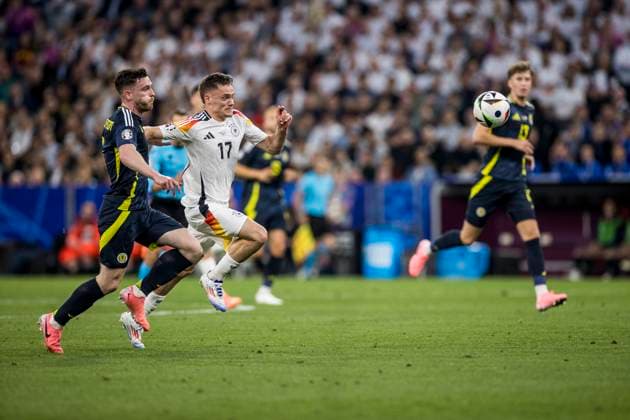 UEFA EURO 2024 Opening match Germany Scotland 14 06 2024 Florian Wirtz Germany, 17 , Andrew Robertson Scotland, 3 UEFA EURO 2024 Opening match Germany Scotland Munich Football Arena, Munich on 14 06 2024 Copyright: xBEAUTIFULxSPORTS Wunderlx