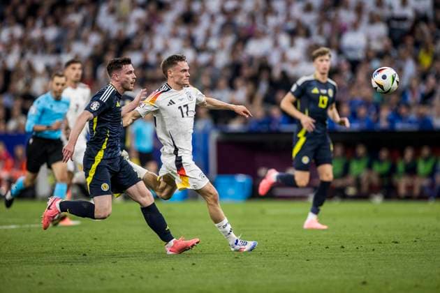 UEFA EURO 2024 Opening match Germany Scotland 14 06 2024 Florian Wirtz Germany, 17 , Andrew Robertson Scotland, 3 UEFA EURO 2024 Opening match Germany Scotland Munich Football Arena, Munich on 14 06 2024 Copyright: xBEAUTIFULxSPORTS Wunderlx