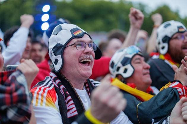 UEFA Euro 2024 Germany Scotland Fan Zone Berlin Brandenburger Tor 14 06 2024 Fans cheering with soccer caps Impressions from the Fan Zone at the Brandenburg Gate in Berlin for the opening match of the European Championship between Germany and Scotland UEFA Euro 2024 14 06 2024 Copyright: xBEAUTIFULxSPORTS Hahnex