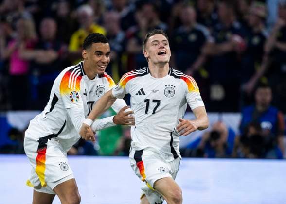 Muenchen, Allianz Arena, 19 09 2021 Florian Wirtz of germany celebrates scoring the 1 0 goal with Jamal Musiala of germany during the match UEFA European Championship 2024 Germany v Scotland