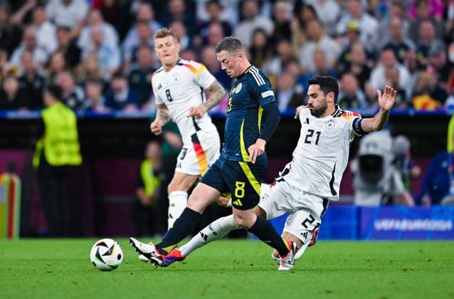 Callum McGregor Scotland and Ilkay Guendogan Germany in a duel, UEFA EURO 2024 Group A, Germany vs Scotland, Munich Football Arena on June 14, 2024 in Munich, Germany Photo by Silas Schueller DeFodi Images Callum McGregor Scotland and Ilkay Guendogan Germany battle for the ball, UEFA EURO 2024 Group A, Germany vs Scotland, Munich Football Arena on June 14, 2024 in Munich, Germany Photo by Silas Schueller DeFodi Images Defodi 0580992927st Defodi-738