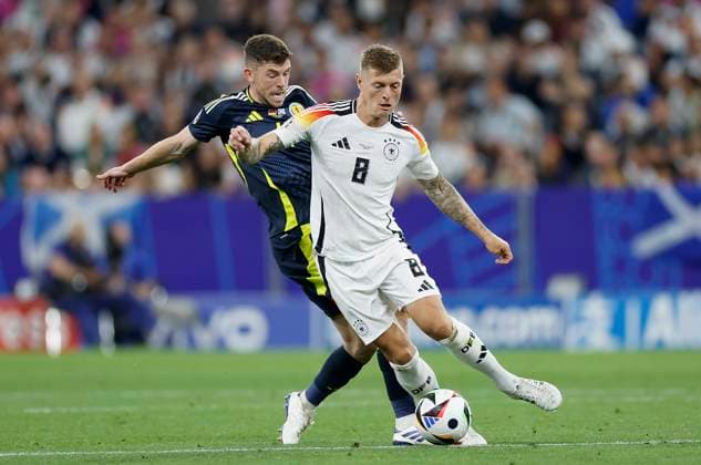 14 06 2024, Football, European Championship, Germany Scotland, GER, Munich, Munich Football Arena, picture from left Ryan Christie Scotland, 11 and Toni Kroos Germany, 8 Copyright: HMBxMedia xHeikoxBecker