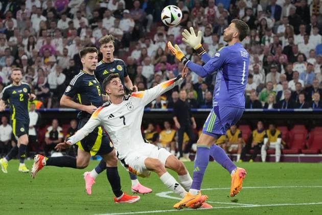 Kai Havertz Germany Germany, 07 joins goalkeeper Angus Gunn Scotland, Scotland, 01 Munich 14 06 2024 Germany vs Scotland, EURO2024 opening match, Group A, EM Arena Munich