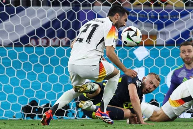 Ryan Porteous of Scotland fouls Ilkay Gündogan of Germany and concedes a penalty Germany v Scotland, UEFA European Championship, EM, Europameisterschaft 2024, Group A, Football, Munich Football Arena, Munich, Germany, 14 Jun 2024 EDITORIAL USE ONLY No use with unauthorised audio, video, data, fixture lists, club league logos or live services. Online in-match use limited to 120 images, no video emulation. No use in betting, games or single club league player publications.  Copyright: xPaulxCurrie Shutterstockx 14523776ef