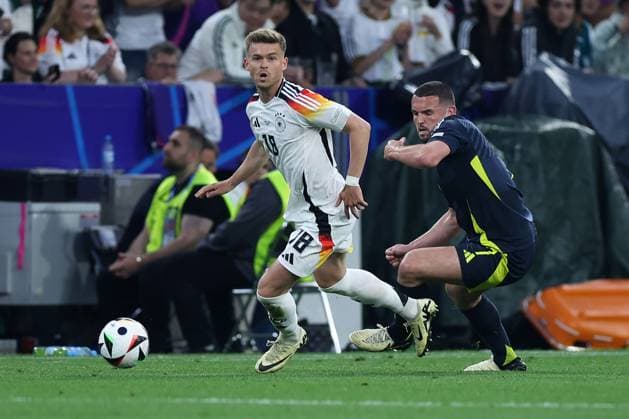 Soccer UEFA EURO 2024 group stage 1 match day opening match Germany Scotland on 14 06 2024 at the Munich Football Arena in Munich Maximilian Mittelstädt Germany , left John McGinn Scotland , right xMSx