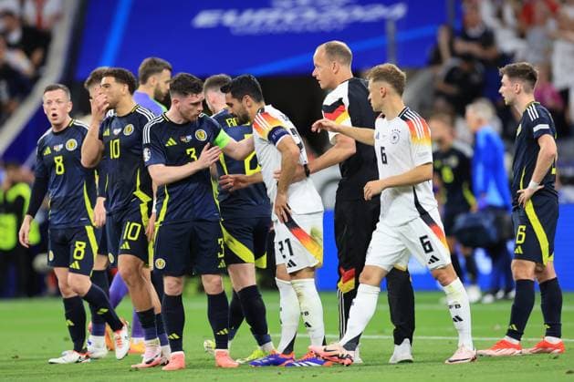 14th June 2024; Munich Football Arena, Munich, Germany; Euro 2024 Group A Football, Germany versus Scotland; 3 Andrew Robertson (SCO) checks on the condition of Ilkay Gundogan (GER) after a high tackle from Ryan Porteous of Scotland  ActionPlus12654413 PierrexTeyssot