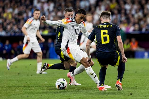 UEFA EURO 2024 Opening match Germany Scotland 14 06 2024 Jamal Musiala Germany, 10 in duel with Kieran Tierney Scotland, 6 UEFA EURO 2024 Opening match Germany Scotland Munich Football Arena, Munich on 14 06 2024 Copyright: xBEAUTIFULxSPORTS Wunderlx