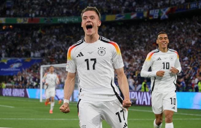 BAU 14 06 2024 Munich European Championship 2024 opening match Germany vs Scotland, from left goal scorer Florian Wirtz GER celebrates the 1-0 goal, right Jamal Musiala GER