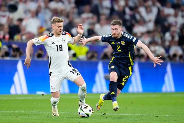 Germany v Scotland: Group A - UEFA EURO, EM, Europameisterschaft,Fussball 2024 Maximilian Mittelstadt left-back of Germany and VfB Stuttgart and Anthony Ralston right-Back of Scotland and Celtic FC during the UEFA EURO 2024 group stage match between Germany and Scotland at Munich Football Arena on June 14, 2024 in Munich, Germany. Munich Germany  Copyright: xJosexBretonx originalFilename:breton-germanyv240614_npuhP.jpg