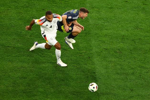 Ryan Christie of Scotland is challenged by Jonathan Tah of Germany Germany v Scotland, UEFA European Championship, EM, Europameisterschaft 2024, Group A, Football, Munich Football Arena, Munich, Germany, 14 Jun 2024 EDITORIAL USE ONLY No use with unauthorised audio, video, data, fixture lists, club league logos or live services. Online in-match use limited to 120 images, no video emulation. No use in betting, games or single club league player publications. Copyright: xKieranxMcManus Shutterstockx 14523770cq