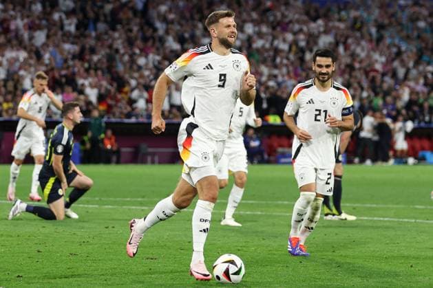 Niclas Füllkrug of Germany celebrates scoring the goal for their side with their teammates to make it 4-0 Germany v Scotland, UEFA European Championship, EM, Europameisterschaft 2024, Group A, Football, Munich Football Arena, Munich, Germany, 14 Jun 2024 EDITORIAL USE ONLY No use with unauthorised audio, video, data, fixture lists, club league logos or live services. Online in-match use limited to 120 images, no video emulation. No use in betting, games or single club league player publications. Copyright: xPaulxCurrie Shutterstockx 14523776fk