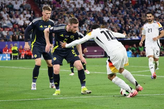 14 06 2024, Football, Men, UEFA European Championship 2024, Opening match, Group A, Germany Scotland, Jamal Musiala Germany , Anthony Ralston Scotland Munich Allianz Arena Bayern Germany EN Copyright: xSebastianxBachx
