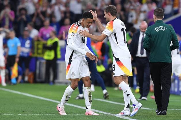Soccer UEFA EURO 2024 group stage 1 match day opening match Germany Scotland on 14 06 2024 at the Munich Football Arena in Munich Jamal Musiala Germany , left Thomas Müller Germany , right xRx