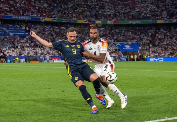 Football, Men, Season 2023 24, Euro 2024 Group A 1 Matchday in Munich, Germany Scotland, v l Lawrence Shankland Scotland , Jonathan Tah Germany , 14 06 2024, Copyright: xMatthiasxKochx