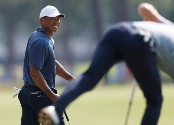 Tiger Woods smiles on the twelfth green during the second round of the 124th U.S. Open golf championship at Pinehurst Resort & Country Club in Pinehurst, N.C. on Friday, June 14, 2024.  NCP20240614778 JOHNxANGELILLO