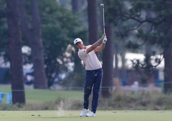 Ludvig Aberg of Sweden hits an approach shot to the twelfth green during the second round of the 124th U.S. Open golf championship at Pinehurst Resort & Country Club in Pinehurst, N.C. on Friday, June 14, 2024.  NCP20240614783 JOHNxANGELILLO