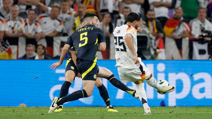 14 06 2024, Football, European Championship, Germany Scotland, GER, Munich, Munich Football Arena, picture v li Grant Hanley Scotland, 5 comes too late, Emre Can Germany, 25 Goal scored, scored the goal to 5 1, celebrate the goal Copyright: HMBxMedia xHeikoxBecker