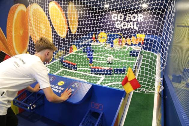 14 06 2024 Dortmund, Fanzone Friedensplatz, broadcast of opening match UEFA EURO2024 Germany vs. Scotland, final score 5 1 Playing by yourself is also fun Here at a giant pinball machine with a soccer as a ball