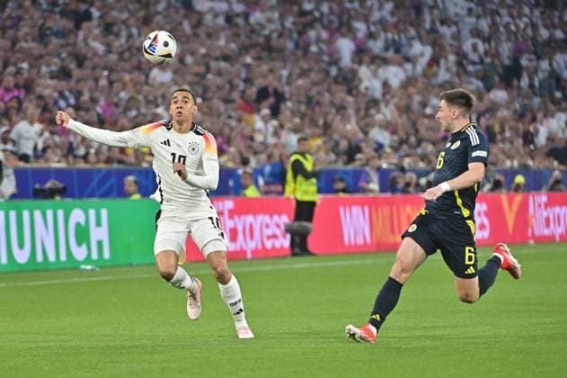 Picture shows Jamal Musiala 10, Germany , Joshua Kimmich 6, Germany , 14 06 2024, Munich, Soccer, European Championship, Germany Scotland, EVENT REGULATIONS PROHIBIT ANY USE OF PHOTOGRAPHS AS IMAGE SEQUENCES AND OR QUASI VIDEO xklx