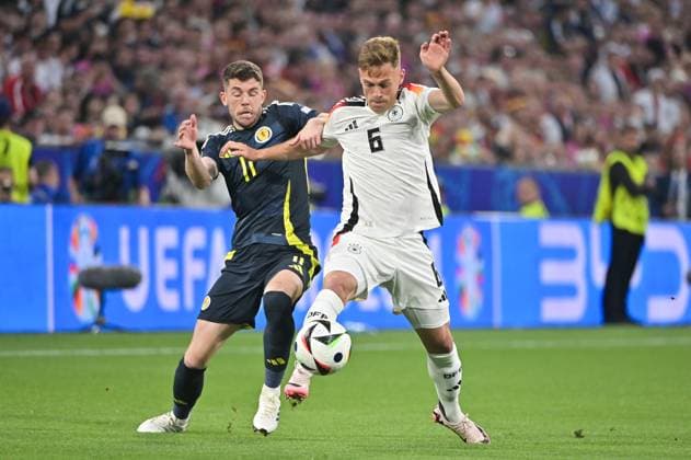 Picture shows from left to right Ryan Christie 11, Scotland , Joshua Kimmich 6, Germany , 14 06 2024, Munich, Football, European Championship, Germany Scotland, EVENT REGULATIONS PROHIBIT ANY USE OF PHOTOGRAPHS AS IMAGE SEQUENCES AND OR QUASI VIDEO xklx