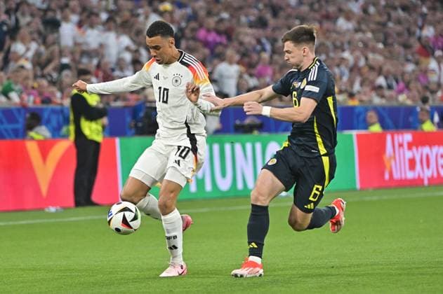 Picture shows Jamal Musiala 10, Germany , Joshua Kimmich 6, Germany , 14 06 2024, Munich, Soccer, European Championship, Germany Scotland, EVENT REGULATIONS PROHIBIT ANY USE OF PHOTOGRAPHS AS IMAGE SEQUENCES AND OR QUASI VIDEO xklx