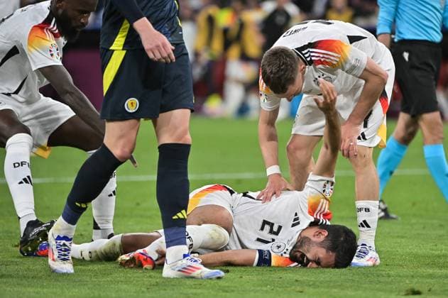 Image shows injury to Ilkay Gündogan 21, Germany , 14 06 2024, Munich, Football, European Championship, Germany Scotland, EVENT REGULATIONS PROHIBIT ANY USE OF PHOTOGRAPHS AS IMAGE SEQUENCES AND OR QUASI VIDEO xklx