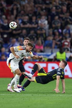 Niclas Füllkrug of Germany is challenged by Kenny McLean of Scotland Germany v Scotland, UEFA European Championship, EM, Europameisterschaft 2024, Group A, Football, Munich Football Arena, Munich, Germany, 14 Jun 2024 EDITORIAL USE ONLY No use with unauthorised audio, video, data, fixture lists, club league logos or live services. Online in-match use limited to 120 images, no video emulation. No use in betting, games or single club league player publications.  Copyright: xPaulxCurrie Shutterstockx 14523776ma