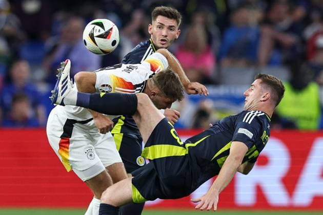 Niclas Füllkrug of Germany is challenged by Kenny McLean of Scotland Germany v Scotland, UEFA European Championship, EM, Europameisterschaft 2024, Group A, Football, Munich Football Arena, Munich, Germany, 14 Jun 2024 EDITORIAL USE ONLY No use with unauthorised audio, video, data, fixture lists, club league logos or live services. Online in-match use limited to 120 images, no video emulation. No use in betting, games or single club league player publications. Copyright: xPaulxCurrie Shutterstockx 14523776lw