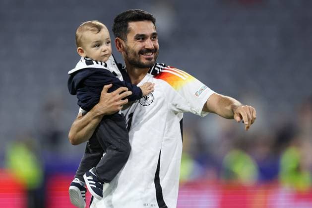 Ilkay Gündogan of Germany with their child at full-time Germany v Scotland, UEFA European Championship, EM, Europameisterschaft 2024, Group A, Football, Munich Football Arena, Munich, Germany, 14 Jun 2024 EDITORIAL USE ONLY No use with unauthorised audio, video, data, fixture lists, club league logos or live services. Online in-match use limited to 120 images, no video emulation. No use in betting, games or single club league player publications.  Copyright: xPaulxCurrie Shutterstockx 14523776mt