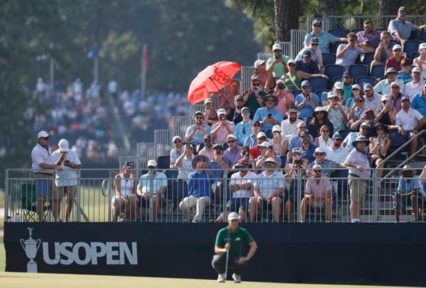 Spectators watch as Matt Fitzpatrick of England lines up a putt on the fifteenth green during the second round of the 124th U.S. Open golf championship at Pinehurst Resort & Country Club in Pinehurst, N.C. on Friday, June 14, 2024.  NCP20240614791 JOHNxANGELILLO
